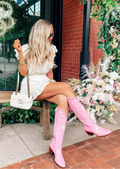 Woman wearing the Pink Mid-Calf Boots with Embroidered White HeartsWhite Hearts