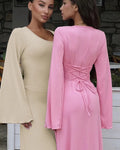 Women wearing the pink Apricot Ribbed Maxi Dress with Trumpet Sleeves