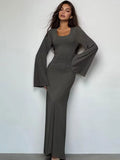 Woman wearing the gray Ribbed Maxi Dress with Trumpet Sleeves