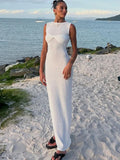 Woman wearing the white Knitted Round Neck Ruched Maxi Dress