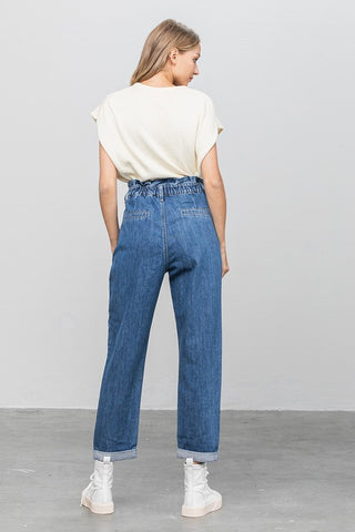 BWoman sporting her back high-waisted Paper Bag Slouch Jeans 