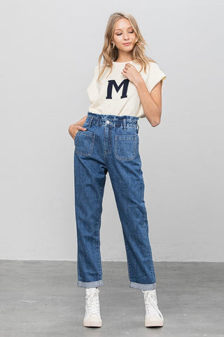 Woman sporting her high-waisted Paper Bag Slouch Jeans