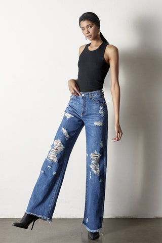 Full image of a woman wearing her Distressed Frayed Hem Dad Jeans