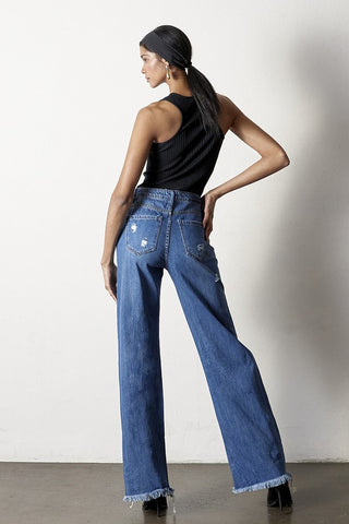 Back details of a woman while wearing her Distressed Frayed Hem Dad Jeans