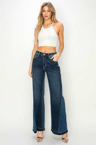 Full image shot of a woman wearing her High-Rise Relaxed Wide-Leg Jeans