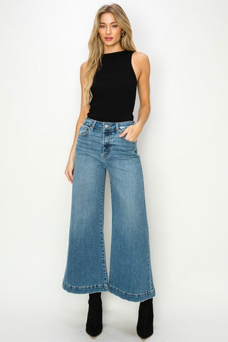 Full image of a woman wearing her High-Rise Crop Palazzo Jeans
