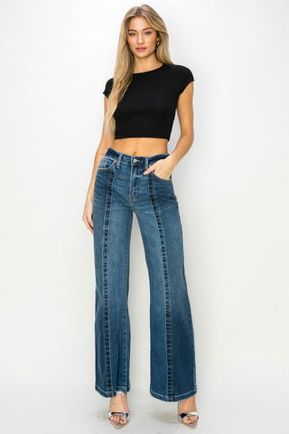 Full image of a woman while her High-Rise Relaxed Flare Jeans 