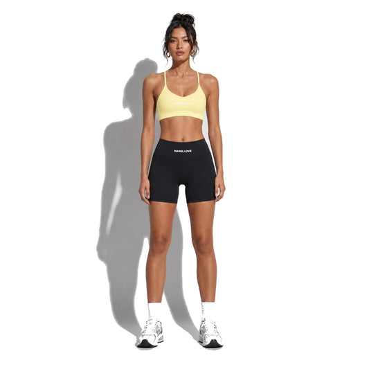 Set — Infinity bra yellow + Legging Shorts black front on-model 2048