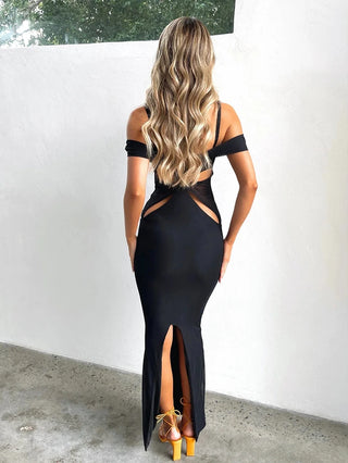 Back Angle of a Woman wearing black Hollow Out Long Dress