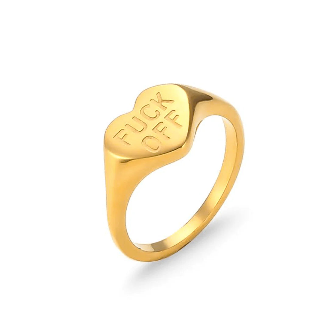 Gold ring with 'FUCK OFF' engraved on a white background