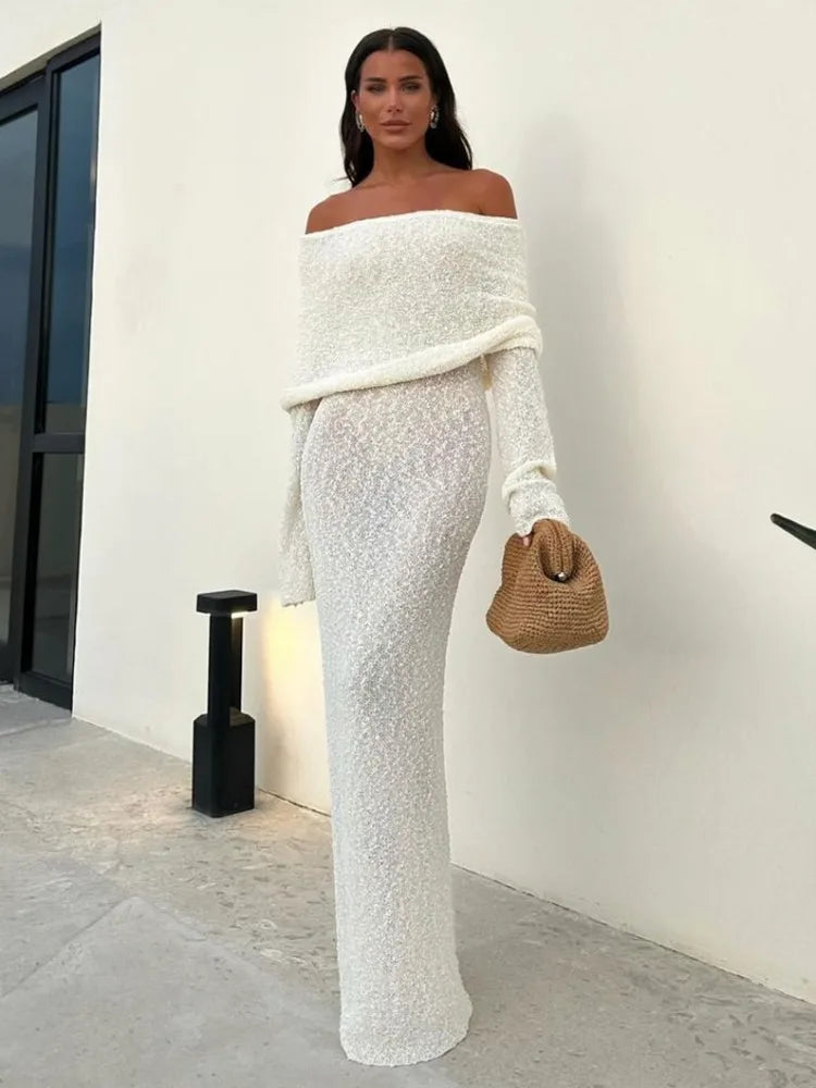 Woman wearing the white Knitted Off-Shoulde Maxi Dress