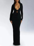 Woman wearing the black Ribbed Long Sleeve Maxi Dress with Lace Up V-Neckline