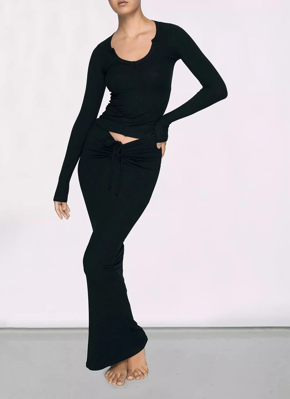 Kim Kardashian's Black High-Waisted Mid-Length Skirt with Hip Wrap
