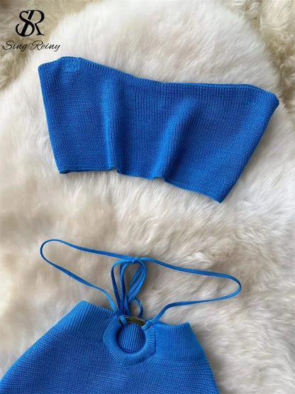Conjunto de top corto sin tirantes y falda con abertura