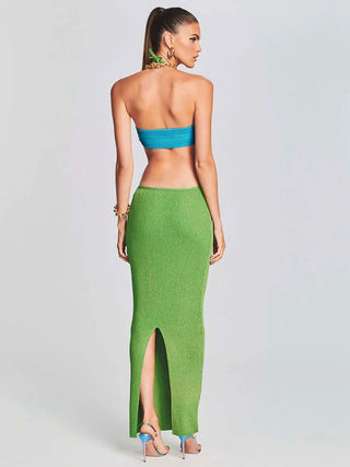 Back Angle of a Woman wearing Green Ribbed Halter Maxi Dress