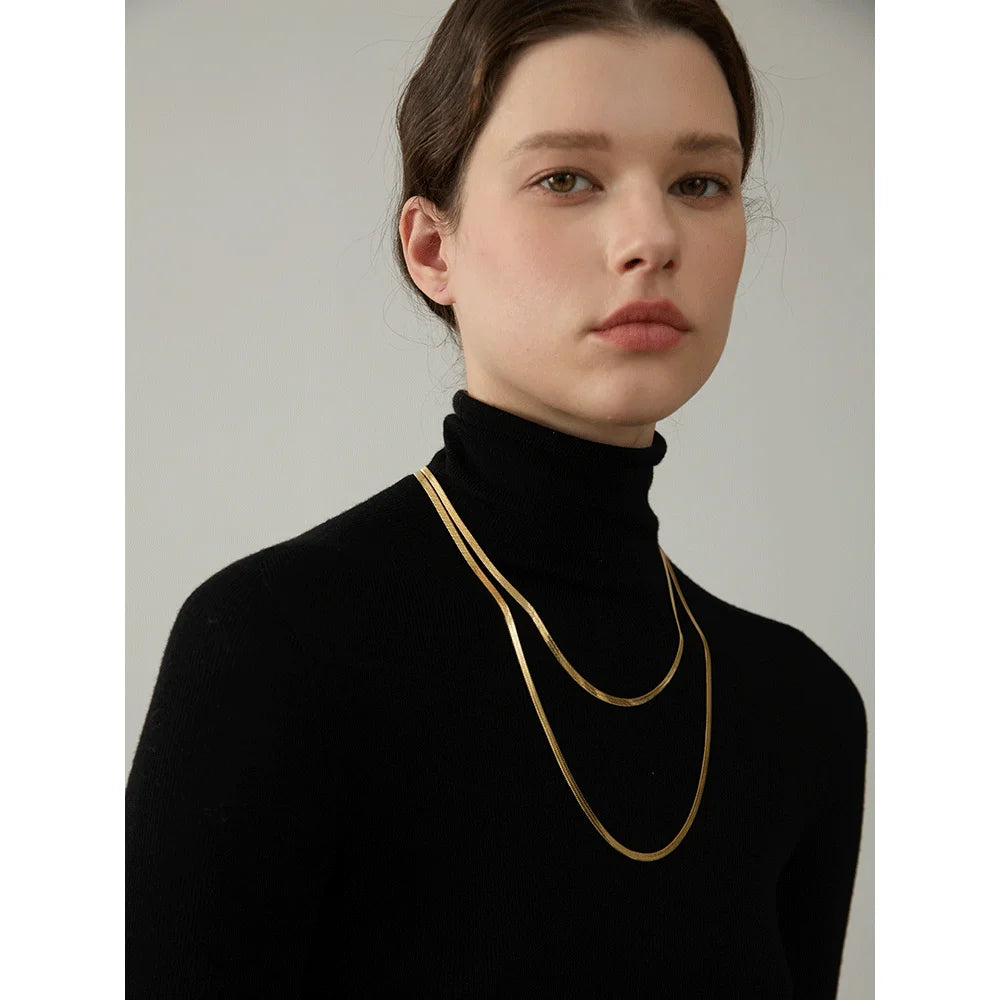 Woman wearing the Gold  Long Flat Snake Stacking Necklace 