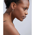 Woman wearing her Zigzag Rectangle Drop Earrings