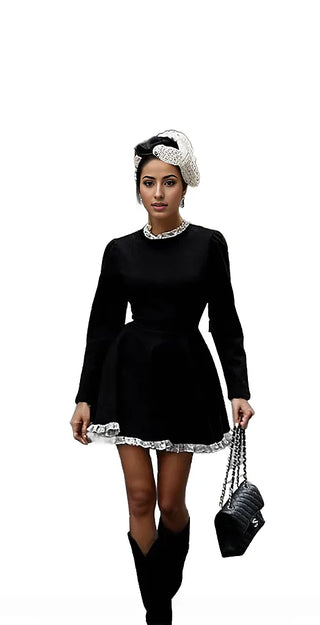 Woman wearing her black Vintage Doll-Inspired Mini Dress