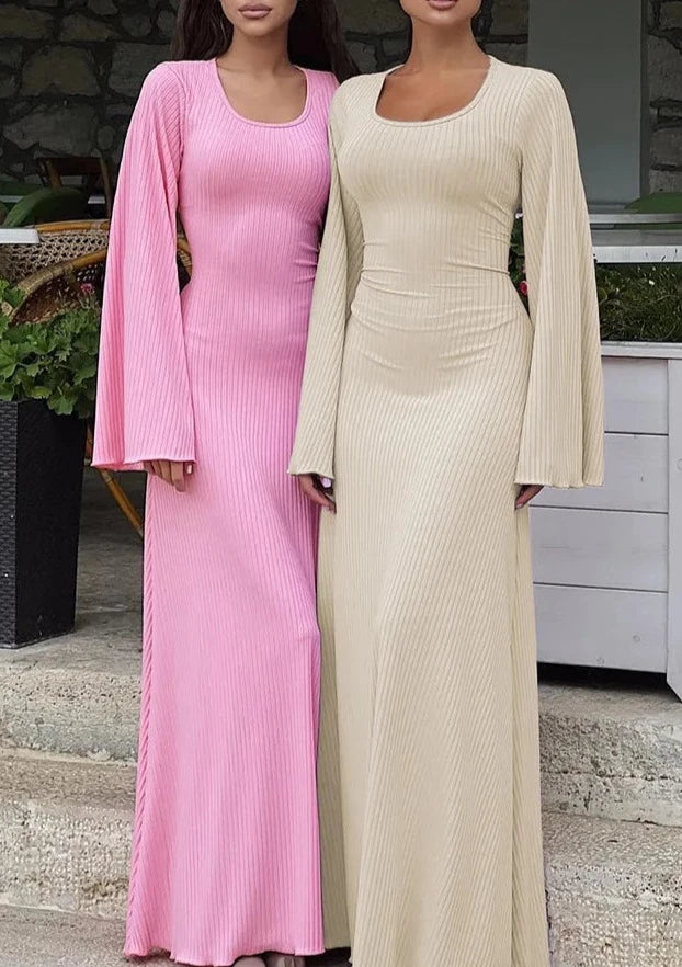 Women wearing the Apricot Ribbed Maxi Dress with Trumpet Sleeves