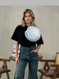 Woman wearing her black Loose T-Shirt with 3D Big Flower