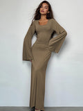Woman wearing the Khaki Ribbed Maxi Dress with Trumpet Sleeves