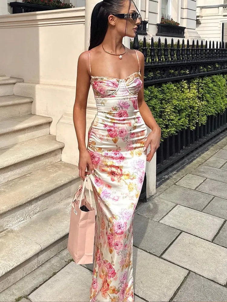 Woman wearing the pink Spaghetti Strap Maxi Dress with Floral Prints