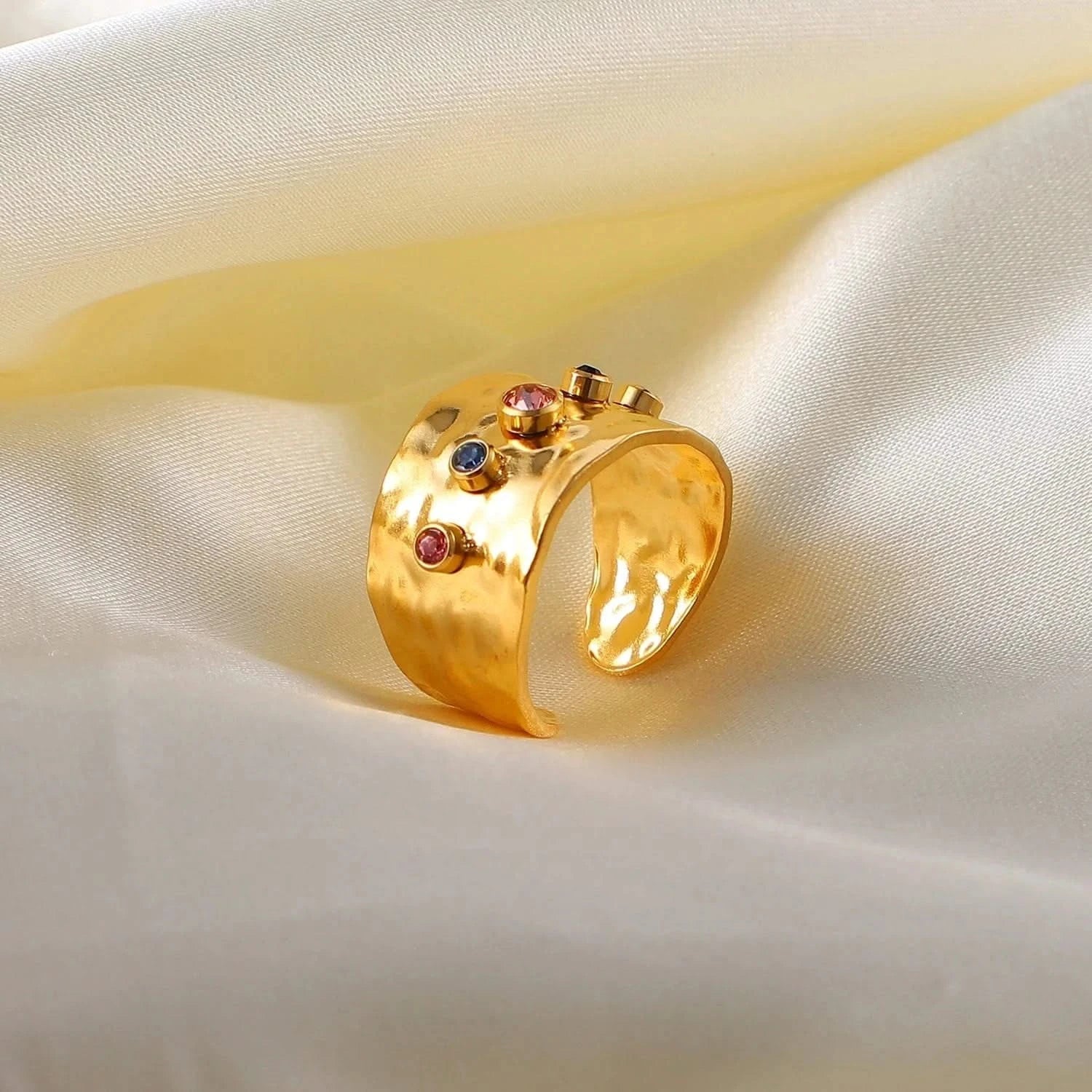 Close-up photo of a gold Ring with a Colorful Cubic Zirconia Crystals