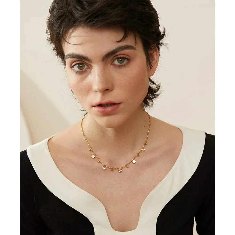 Woman wearing her Station Necklace