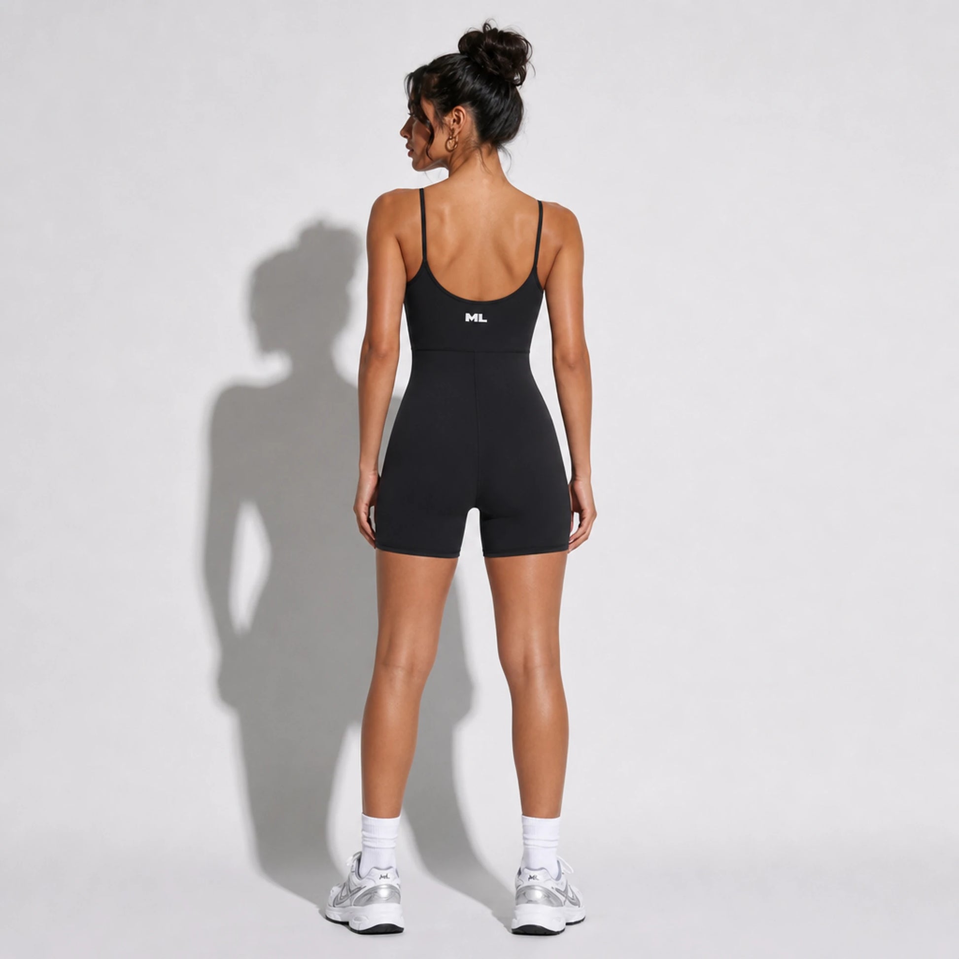 One Piece Yoga Romper — black back on-model 2048