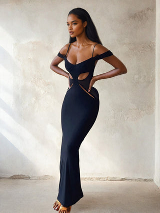 Side Angle of a Woman wearing black Hollow Out Long Dress