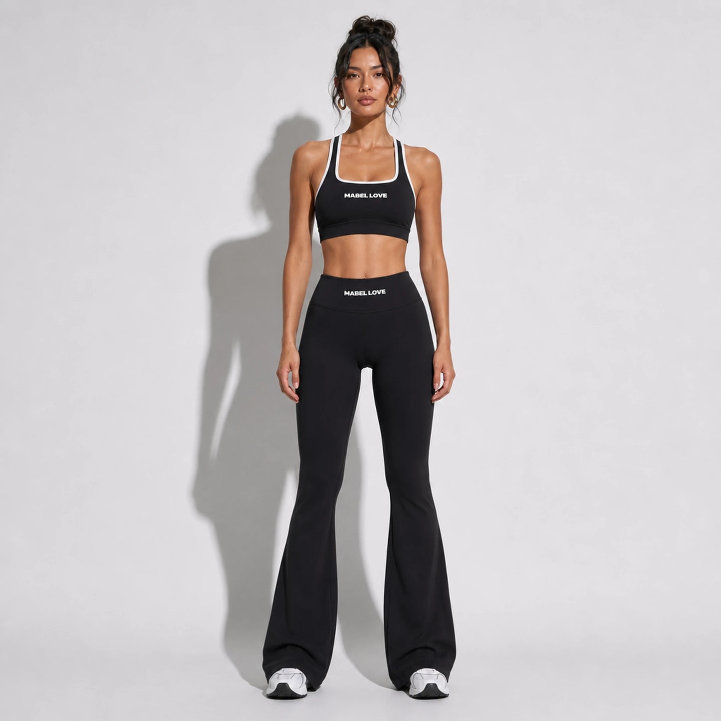 Set — High Support bra + Scrunch Butt Leggings black front on-model 2048 (floor-length flare)