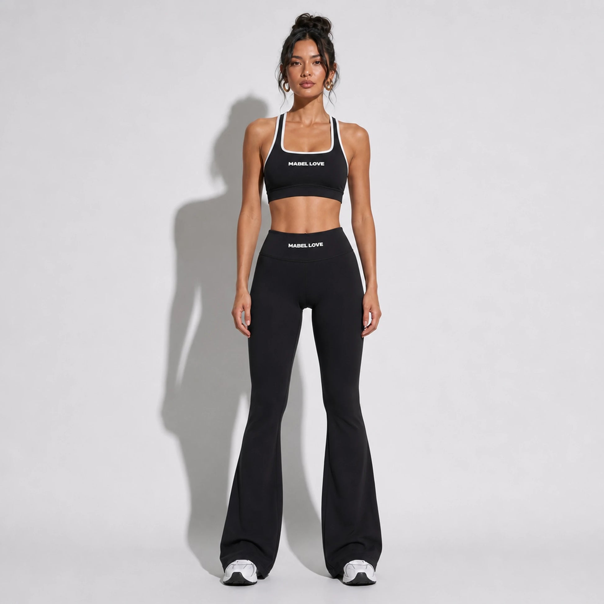 Set — High Support bra + Scrunch Butt Leggings black front on-model 2048 (floor-length flare)
