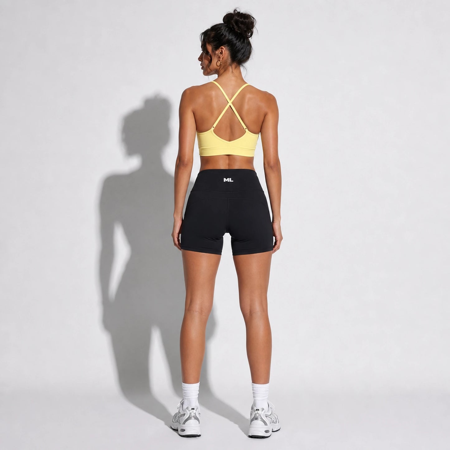 Set — Infinity bra yellow back + Legging Shorts black back on-model 2048