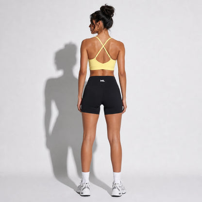 Set — Infinity bra yellow back + Legging Shorts black back on-model 2048