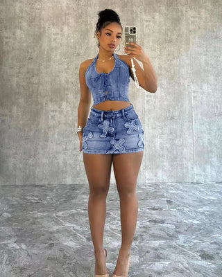 Full shot of a woman while wearing her denim Patch Cross Skirt and Lace Up Top Set