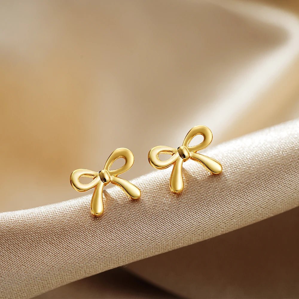 Close - up image of Gold Ribbon Stud Earrings